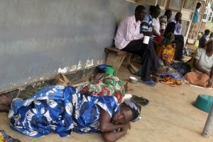 Mothers sleep on the verandah at Anyeke Health Centre IV on Monday as they wait to be attended to