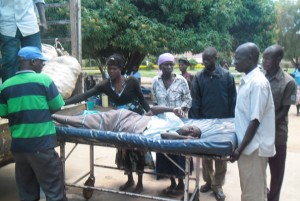 Ms Florence Candiru is carried onto a truck with goats and goods at Olujobo Health Centre. PHOTO BY Felix Akello Warom