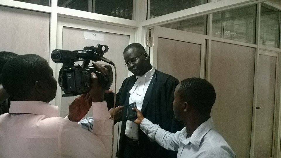 Counsel Nicholas Opio briefing the media at the constitutional court